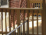Side view of trellis style porch made of pressure treated lumber for kitchen exterior entrance at home on University Boulevard, Silver Spring, MD.