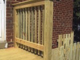 Close up of porch railing (right) on top landing or porch made of pressure treated lumber at home on Seminary Road, Silver Spring, MD.