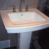 Pedestal sink and faucet after remodel in home on Bradley Boulevard in Bethesda, MD. 