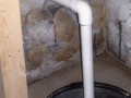 Sump pump installation in basement remodel at home on Wisconsin Ave. NW near Washington National Cathedral.