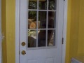 New exterior door and finished walls installed by Pro Home Service and Repair in basement apartment at home on Wisconsin Ave. NW near Washington National Cathedral.