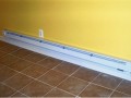 Baseboard heat and tile floor installed by Pro Home Service and Repair  in basement apartment at home on Wisconsin Ave. NW near Washington National Cathedral.