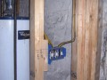 Hot water heater and framing for laundry room in basement remodel at home on Wisconsin Ave. NW near Washington National Cathedral.