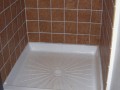 Floor of shower stall and wall tile of bathroom installed by Pro Home Service and Repair in basement apartment at home on Wisconsin Ave. NW near Washington National Cathedral.