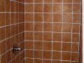 Close up of shower tile in bathroom installed by Pro Home Service and Repair in basement apartment at home on Wisconsin Ave. NW near Washington National Cathedral